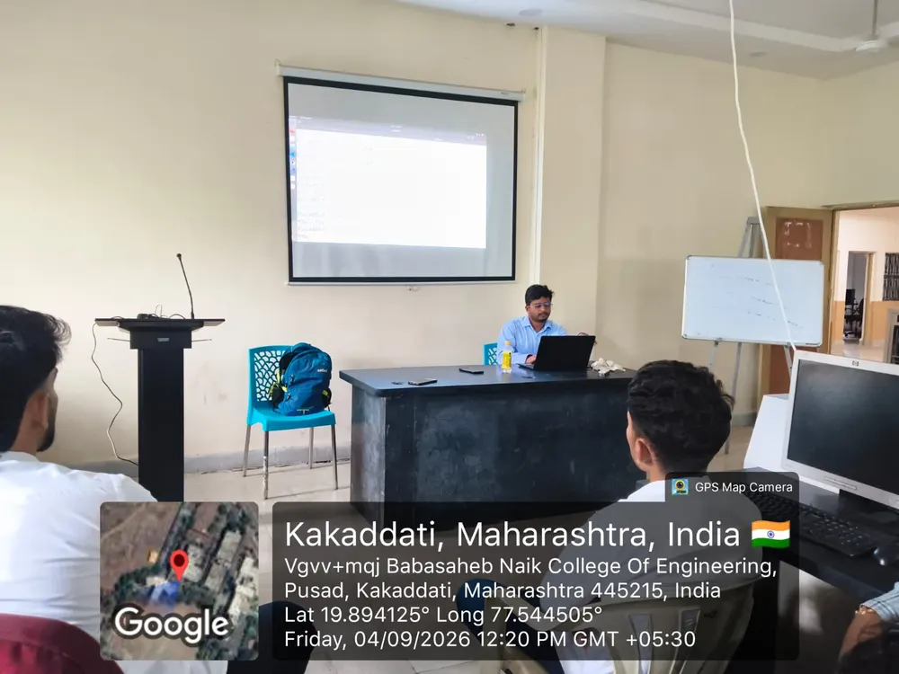 Instructor Sujeet Chavhan teaching with code on the projector screen